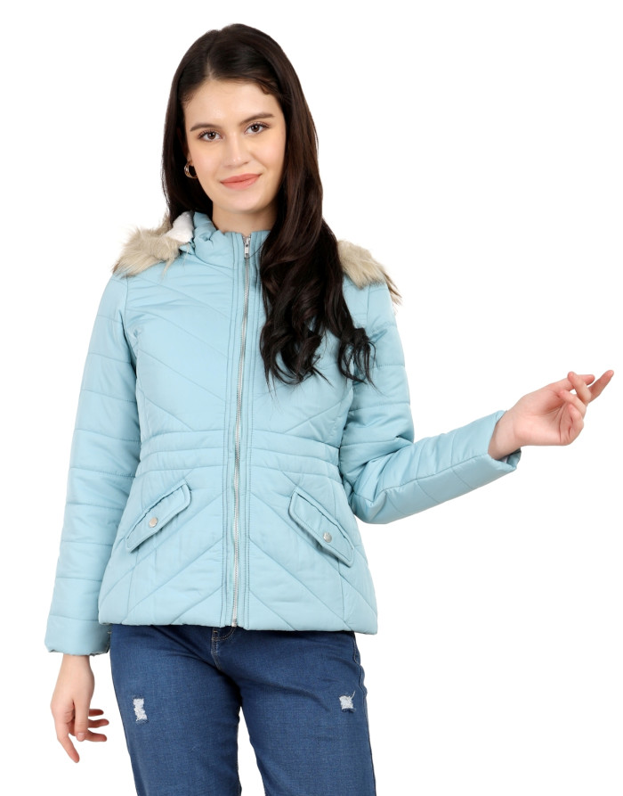 A woman is giving a standing side pose wearing Coatsnmore’s casual jacket in Sea Green colour with a textured pattern, slash placket pockets, a zip closure, a detachable hood and blue jeans.